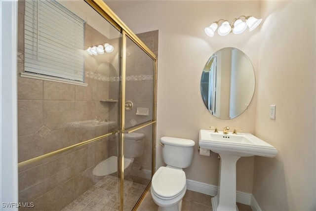 bathroom featuring toilet, an enclosed shower, and tile patterned flooring