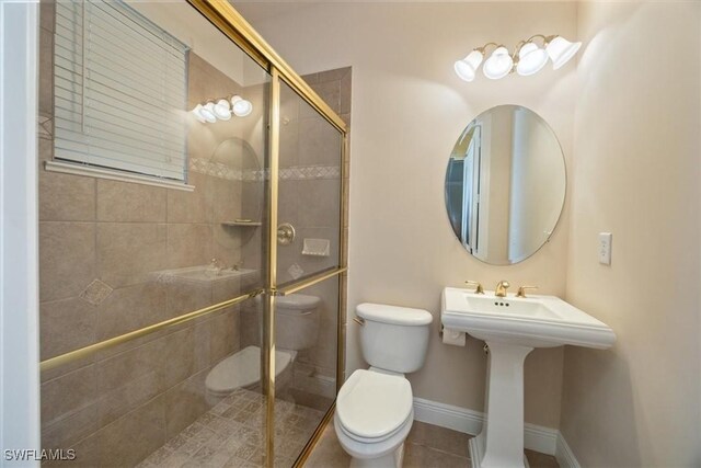28830 Kiranicola Ct, Bonita Springs, FL 34135 - full bath with toilet, a stall shower, tile patterned floors, and baseboards