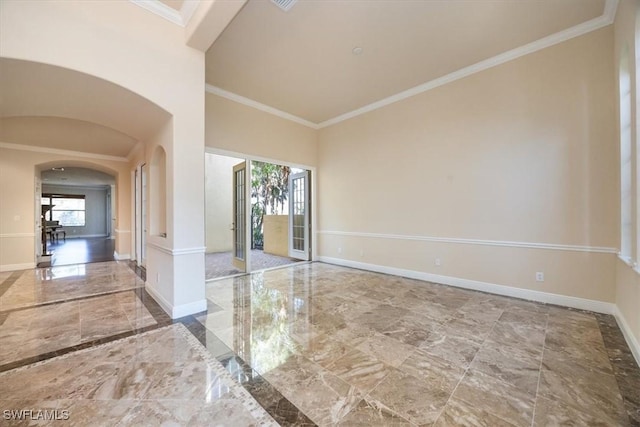 unfurnished room featuring crown molding