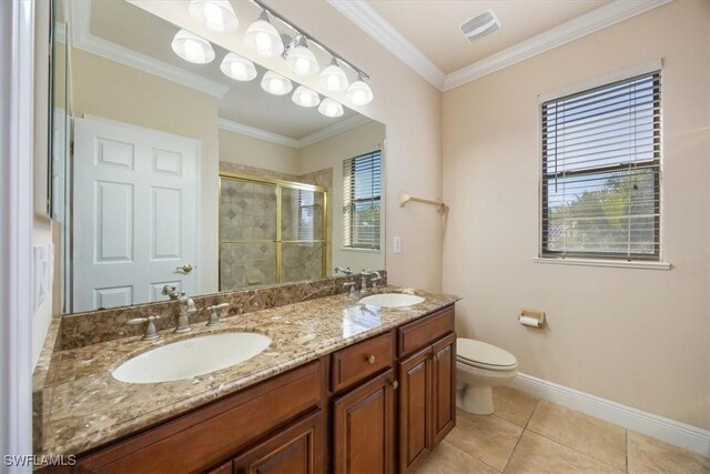 bathroom featuring crown molding, vanity, an enclosed shower, and tile patterned flooring