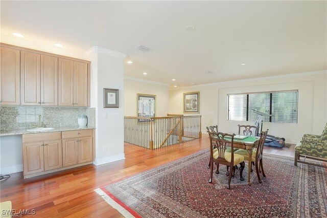 28830 Kiranicola Ct, Bonita Springs, FL 34135 - dining area with light wood-style floors, ornamental molding, recessed lighting, and baseboards