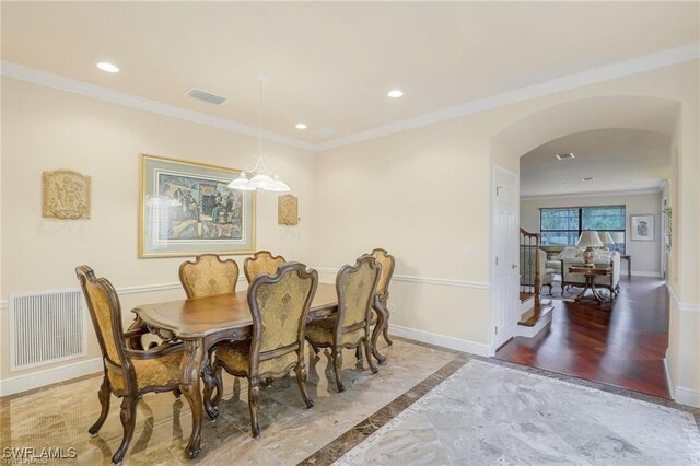 28830 Kiranicola Ct, Bonita Springs, FL 34135 - dining area featuring arched walkways, baseboards, ornamental molding, recessed lighting, and inlaid floor details