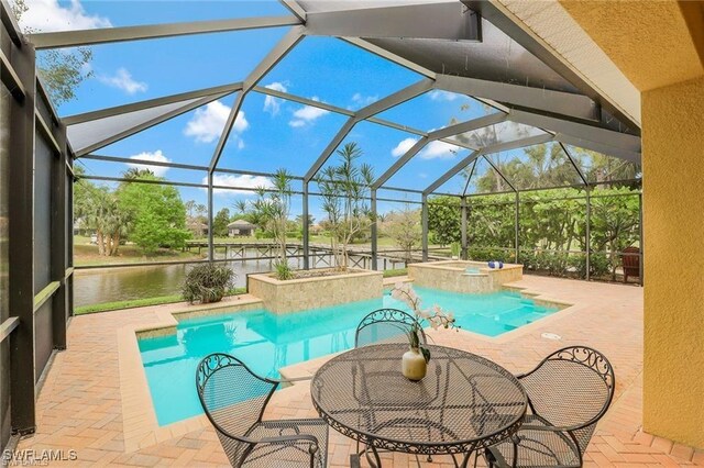 28830 Kiranicola Ct, Bonita Springs, FL 34135 - view of swimming pool featuring a patio, a pool with connected hot tub, and a lanai