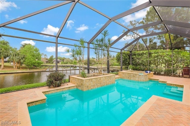 28830 Kiranicola Ct, Bonita Springs, FL 34135 - view of swimming pool featuring a patio, a water view, a pool with connected hot tub, and a lanai
