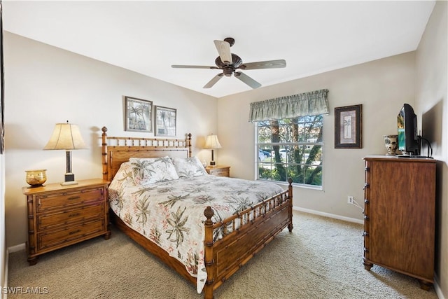 bedroom featuring light carpet and ceiling fan