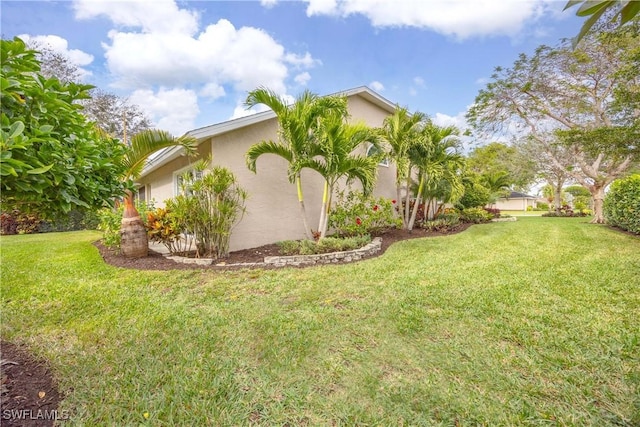 744 Belville Blvd, Naples, FL 34104 - view of home's exterior with a lawn