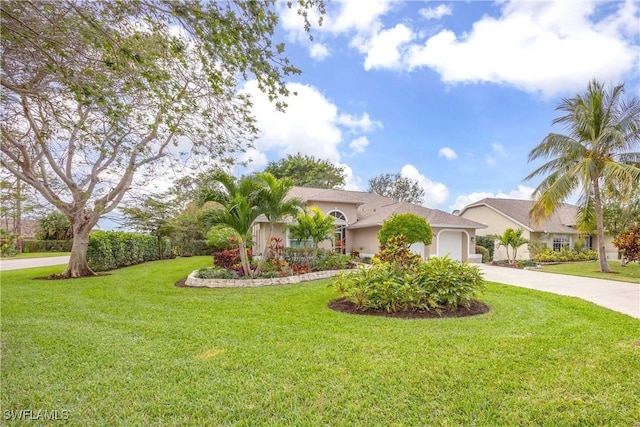 view of front of home featuring a garage and a front yard