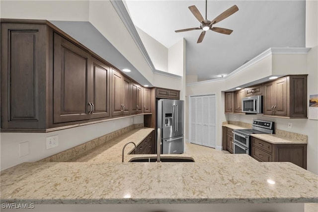 744 Belville Blvd, Naples, FL 34104 - kitchen with sink, dark brown cabinets, kitchen peninsula, and appliances with stainless steel finishes