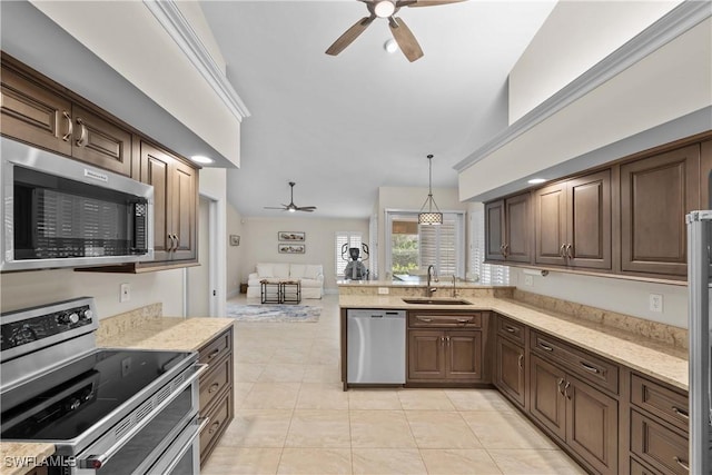 744 Belville Blvd, Naples, FL 34104 - kitchen with pendant lighting, sink, ceiling fan, and appliances with stainless steel finishes