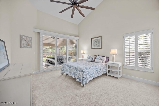 744 Belville Blvd, Naples, FL 34104 - bedroom with multiple windows, light carpet, and access to outside