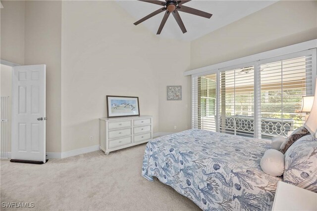 744 Belville Blvd, Naples, FL 34104 - bedroom featuring access to outside, light carpet, ceiling fan, and a towering ceiling