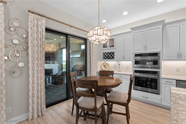 dining room with light hardwood / wood-style floors