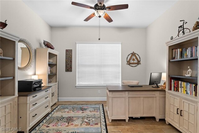 office area with ceiling fan and a wealth of natural light