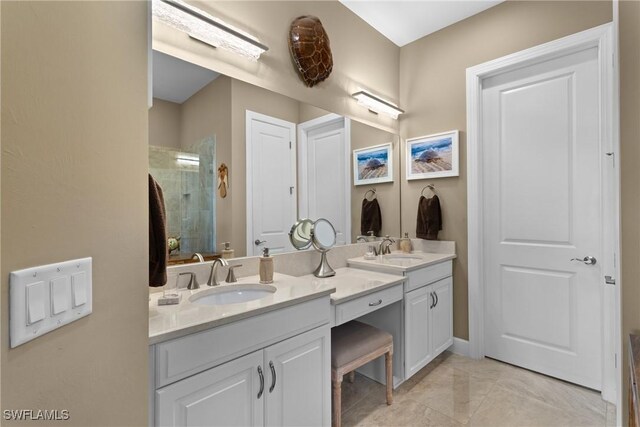 bathroom with vanity and an enclosed shower