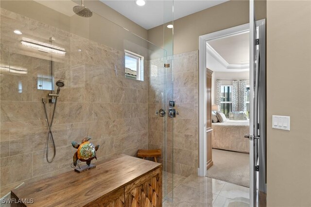 bathroom with tiled shower