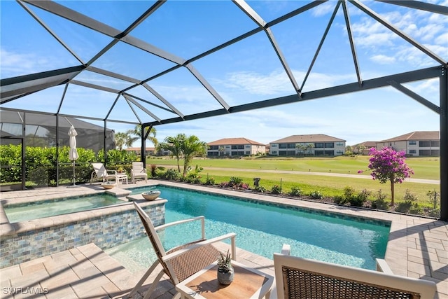 view of pool featuring a lanai, a patio area, and an in ground hot tub