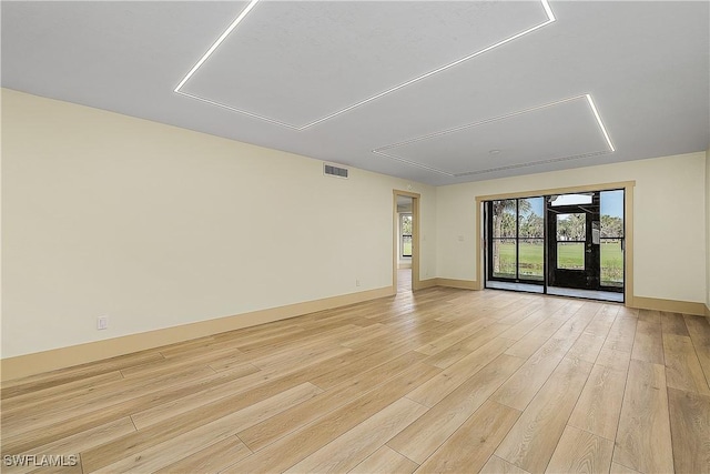 unfurnished room featuring light hardwood / wood-style flooring