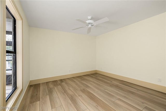 empty room featuring light hardwood / wood-style floors and ceiling fan