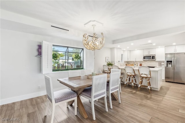 dining space featuring a chandelier