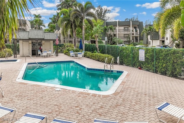 view of swimming pool with a patio