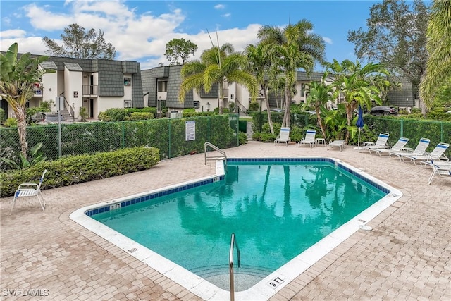 view of swimming pool with a patio