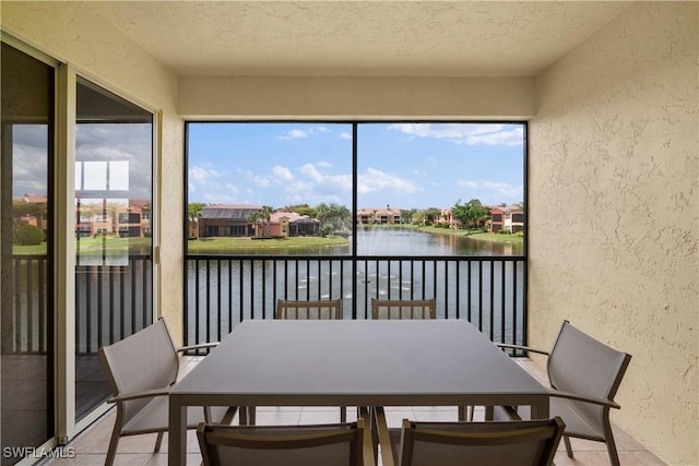 sunroom with a water view