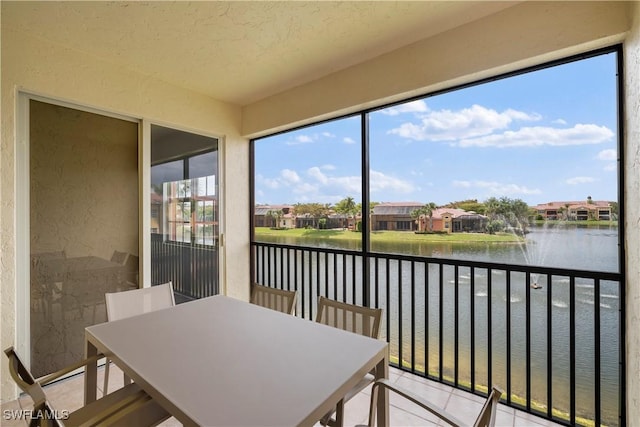 8598 Via Lungomare Cir Unit 203, Estero, FL 33928 - sunroom with a water view and a residential view