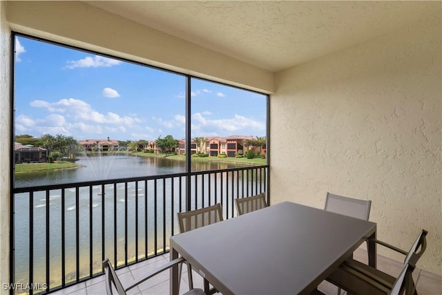 8598 Via Lungomare Cir Unit 203, Estero, FL 33928 - sunroom featuring a water view and a residential view
