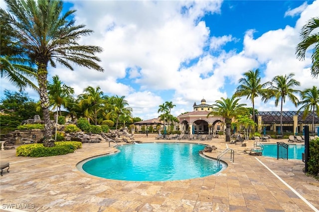 view of swimming pool with a patio and a gazebo