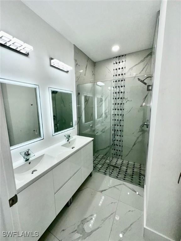 bathroom featuring an enclosed shower and vanity