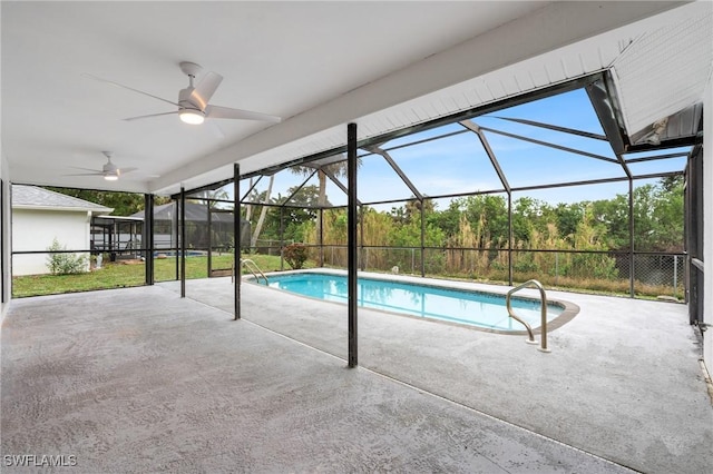 pool with a lanai, a patio area, and ceiling fan