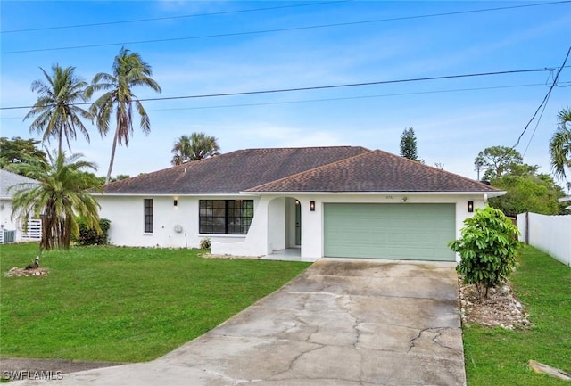 single story home featuring a garage and a front yard