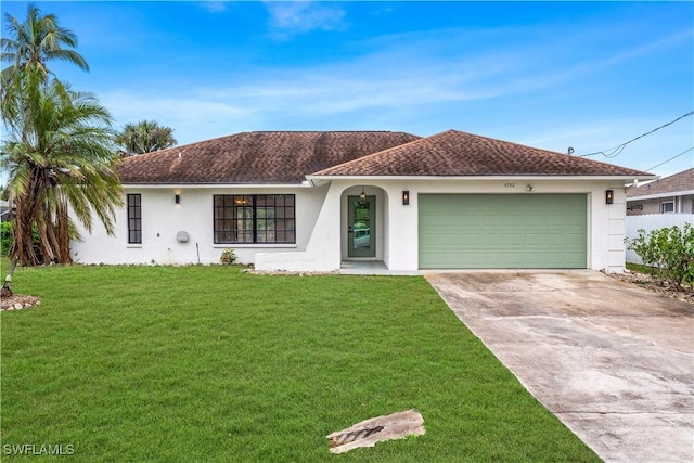 view of front of home featuring a garage and a front yard