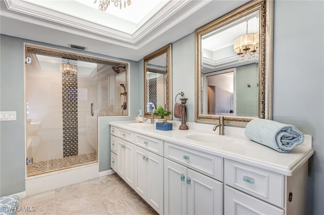 bathroom with ornamental molding, a shower with shower door, vanity, and a notable chandelier