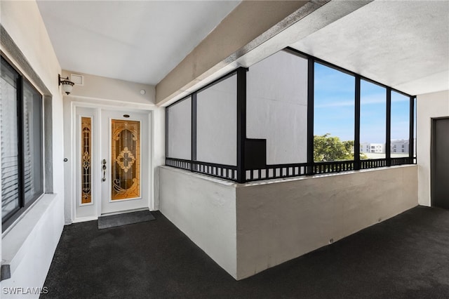 entrance to property with a balcony