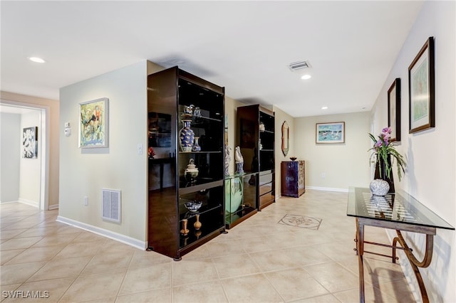 hallway with light tile patterned floors