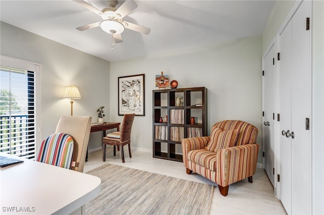 office area with ceiling fan and light hardwood / wood-style floors