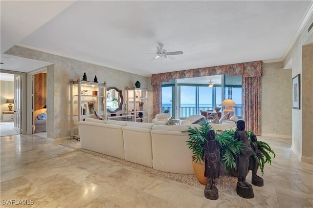 living room with ceiling fan, a water view, and crown molding