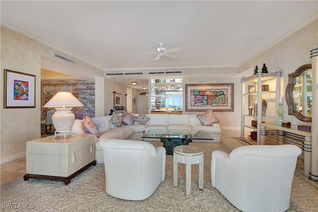 living room featuring ceiling fan and ornamental molding