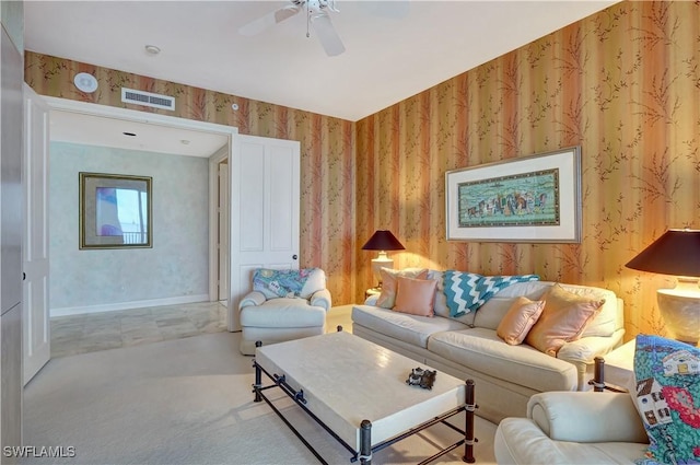 carpeted living room with ceiling fan