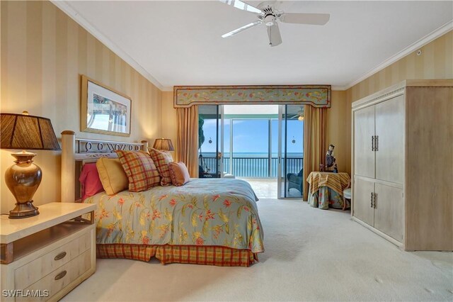 bedroom featuring ceiling fan, crown molding, a water view, light colored carpet, and access to exterior