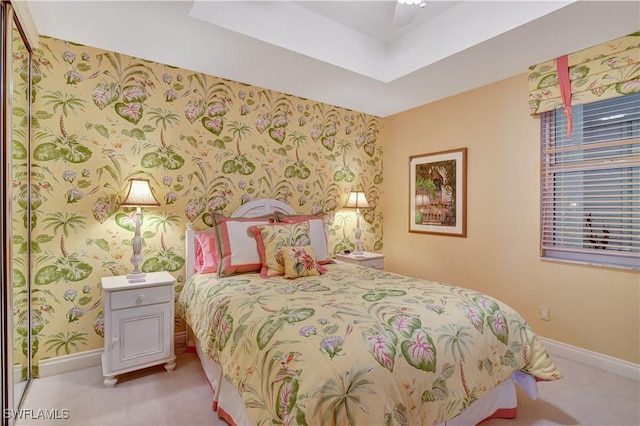 bedroom with light carpet and ceiling fan