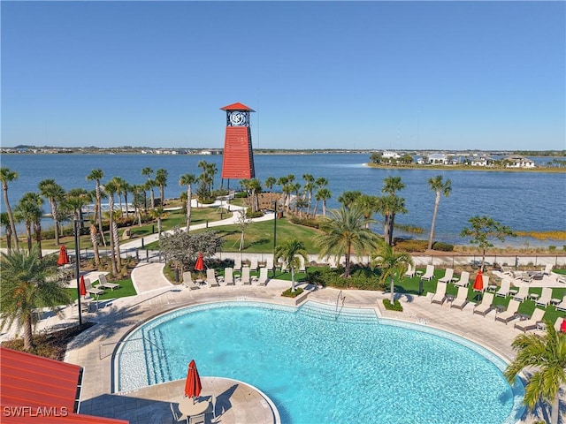 view of pool with a water view and a patio area