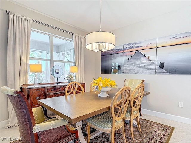 dining space featuring light tile patterned flooring