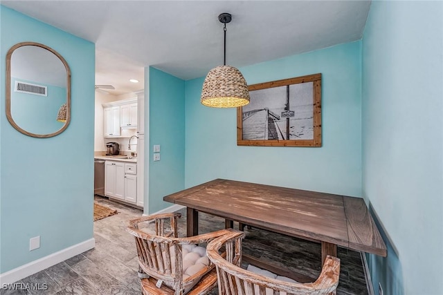 dining space featuring sink