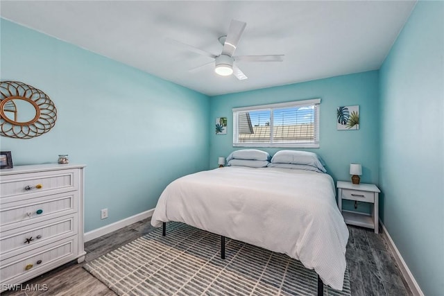 bedroom with ceiling fan and dark hardwood / wood-style floors