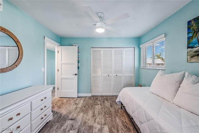 bedroom featuring light hardwood / wood-style floors, a closet, and ceiling fan