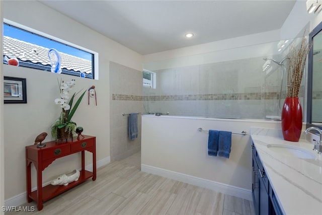 bathroom featuring vanity and a tile shower