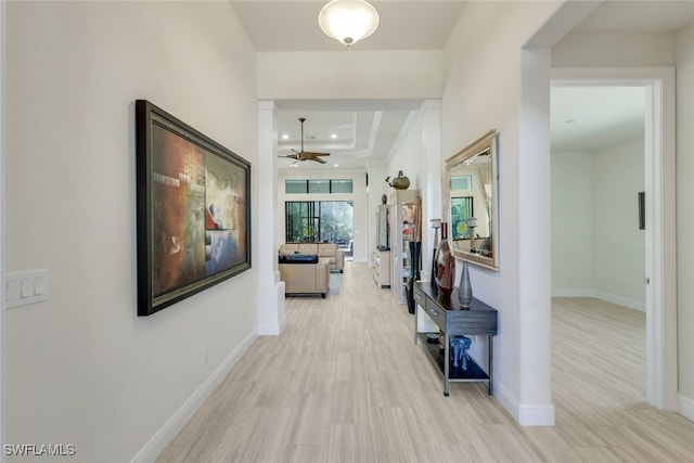 hallway with light hardwood / wood-style flooring