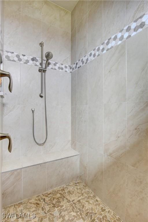 bathroom with a tile shower